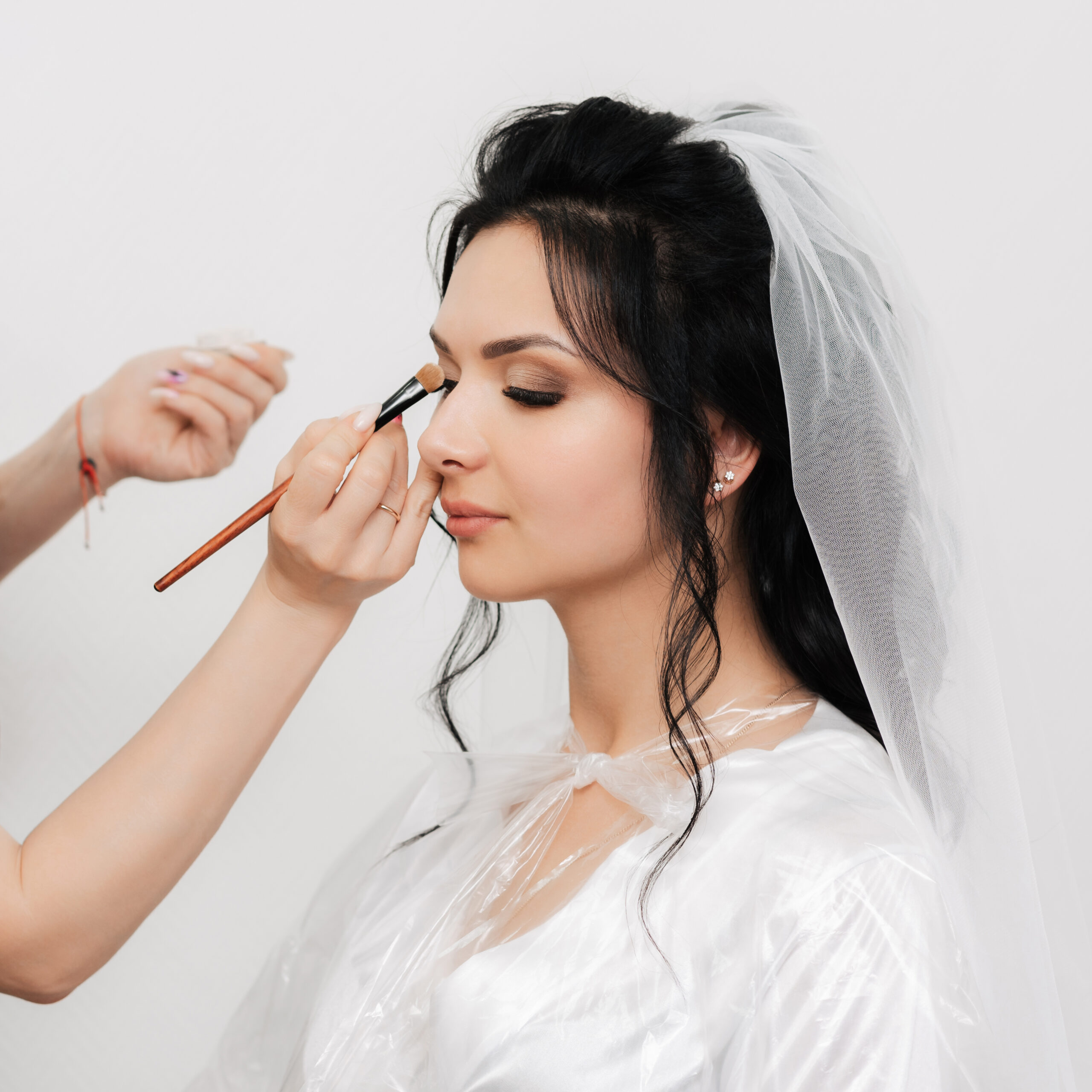 makeup artist hands with brush makes up apply shadows eyes brides girl beauty salon scaled